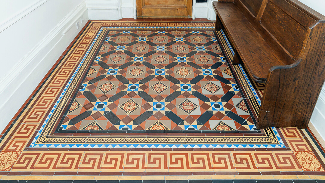 Restoration of period floor tiles in vestibule.