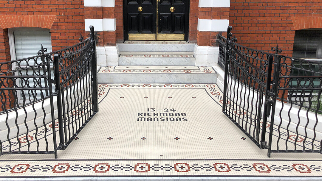 Grand entrance steps with border motif and text composed of 20mm square tiles.