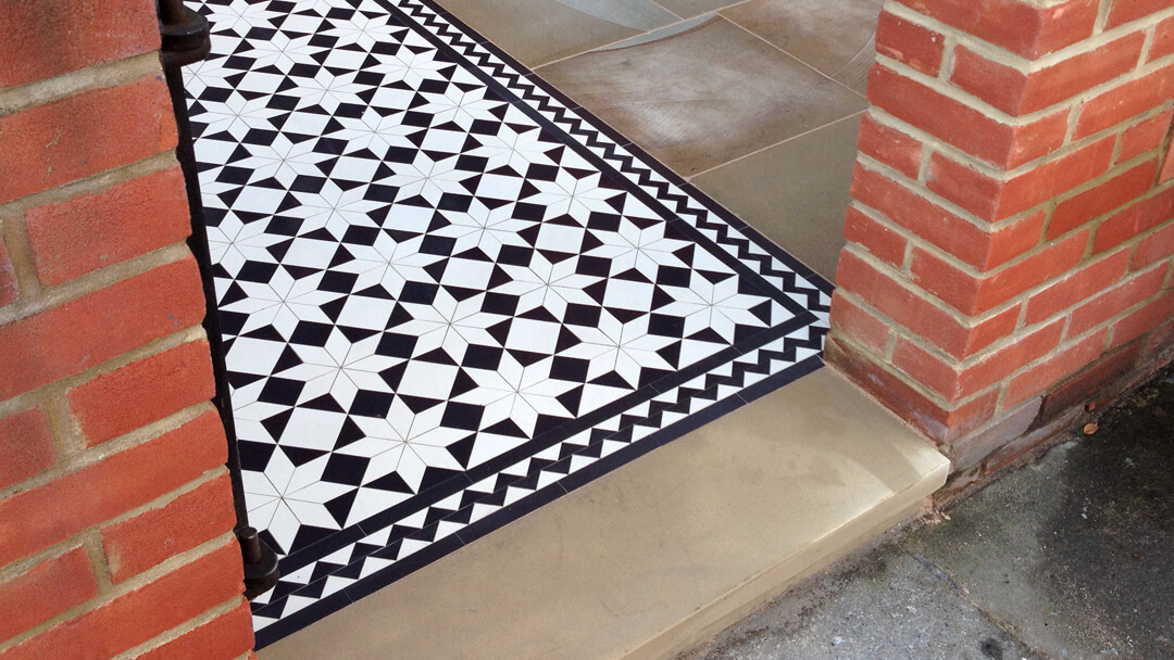 Traditional Victorian pattern combining custom cut diamond shape with standard geometric tiles.